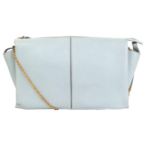 celine tri fold clutch on chain blue